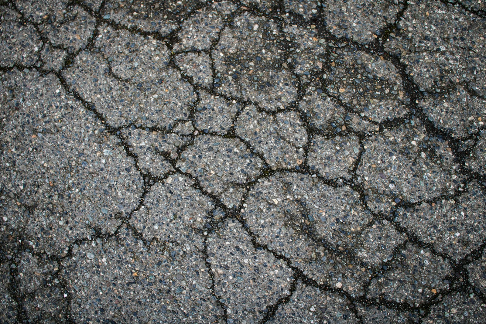 Cracked asphalt covers the entire surface.